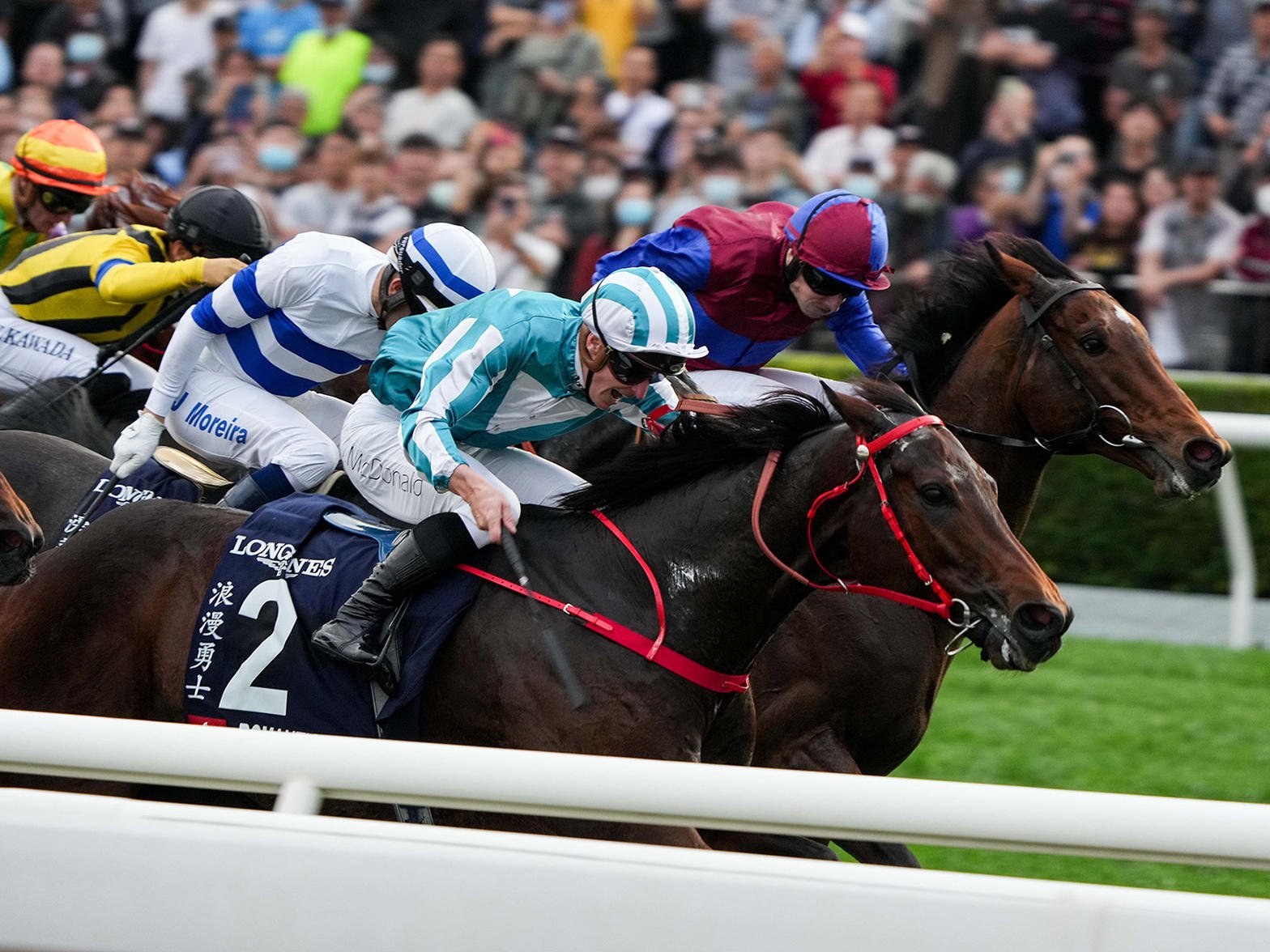 Jockeys and horses in action at Sha Tin